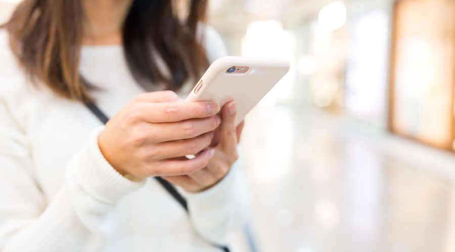 A woman receiving an A2P SMS